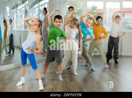 Group of children warming up before dance class Stock Photo