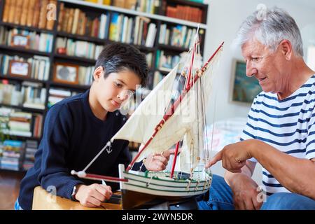 Grandfather and grandson, Building model sailboat, Whaleship, Getaria, Gipuzkoa, Basque Country, Spain, Europe. Stock Photo