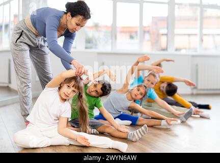 Group of children warming up before dance class Stock Photo