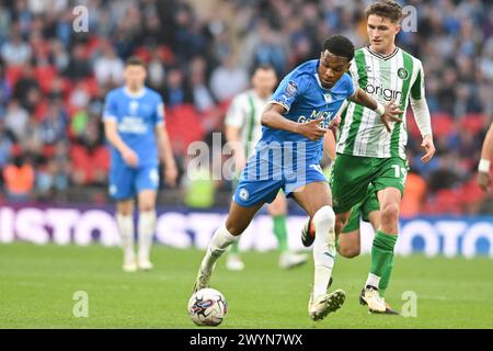 Malik Mothersille (18 Peterborough United) challenged by Freddie Potts (19 Wycombe Wanderers) during the EFL Trophy match between Peterborough and Wycombe Wanderers at Wembley Stadium, London on Sunday 7th April 2024. (Photo: Kevin Hodgson | MI News) Credit: MI News & Sport /Alamy Live News Stock Photo
