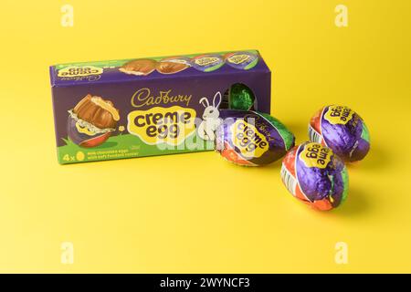 box of cadburys milk chocolate creme eggs yellow background Stock Photo