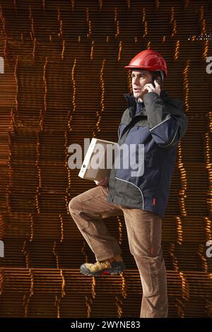 Architect, corrugated iron for formwork, housing construction. Stock Photo
