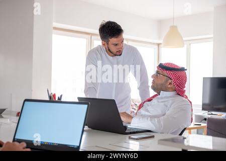 Engaging in gossip or speaking negatively about colleagues behind their backs is detrimental to the workplace environment and fosters distrust among t Stock Photo