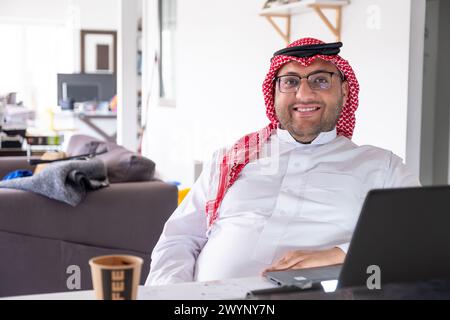 Portrait for mid age man using laptop to working from home while wearing his formal wears Stock Photo