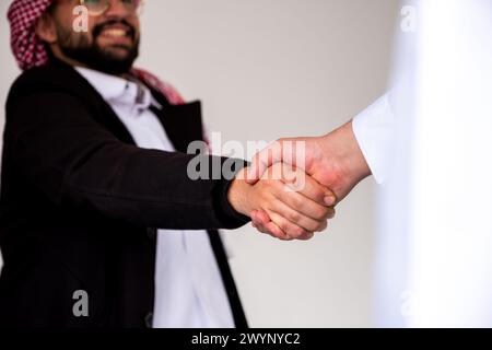 Arab shaking hands friendly and lovely Stock Photo