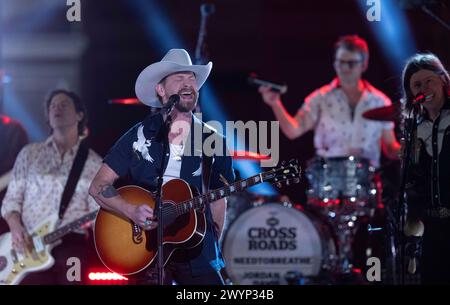 American country rock band NEEDTOBREATHE with lead singer BEAR RINEHART performs at a taping of CMT Country Crossroads in front of the University of Texas Tower on April 5, 2024. At right is bassist SETH BOLT Credit: Bob Daemmrich/Alamy Live News Stock Photo