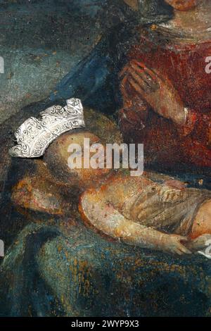 Baby Jesus in the lap of his Mother Mary, altarpiece at St. Mary's Church in Novalja, Croatia Stock Photo