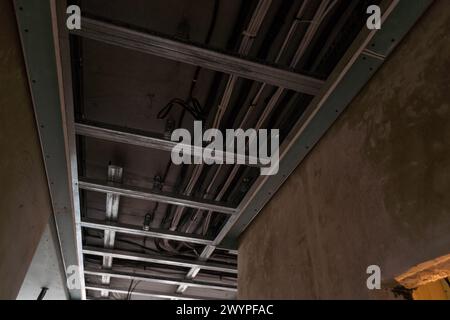 Electrical wiring in a protective corrugation. Installation and wiring of electrical networks in an apartment or house. Close-up Stock Photo