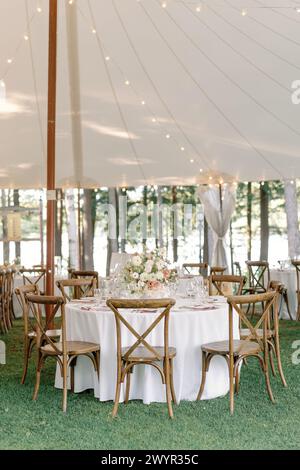 Elegant tented wedding reception by the lake Stock Photo