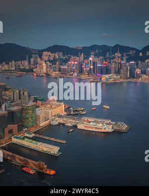 People view the illuminated skyline of Hong Kong at night from a ...