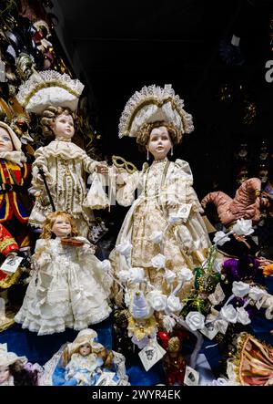 Traditionally lace dressed dolls on display in a shop for sale as typical tourist souvenirs in a shop in the Castello area of Venice, Italy Stock Photo