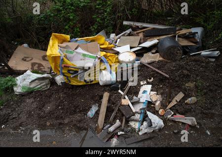 Harefield, UK. 8th April, 2024. Ilegal fly-tipping on a country road in Harefield, Uxbridge despite being just near to fly-tipping warning signs and CCTV surveillance that tell people they could be fined up to £20,000 for fly-tipping. Credit: Maureen McLean/Alamy Live News Stock Photo