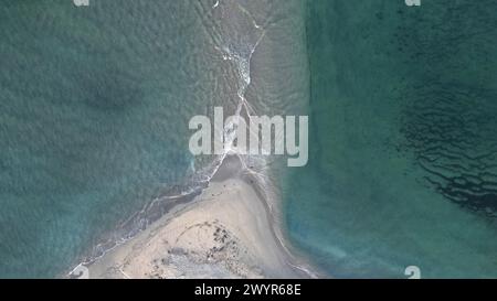 Aerial view of waves breaking on a sandy shore Stock Photo