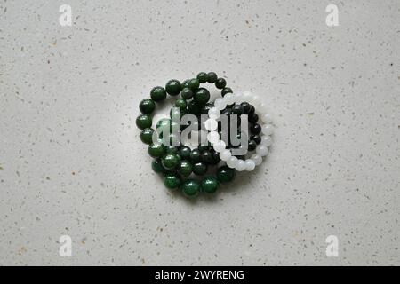 green and white bracelet on the table Stock Photo