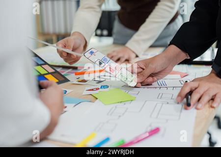 UI designer and UX developer brainstorm idea to design the application interface. Creative digital development agency. UX UI concept Stock Photo