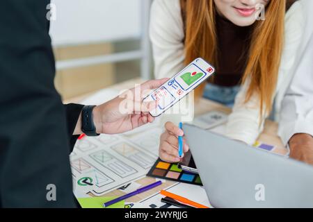 UI designer and UX developer brainstorm idea to design the application interface. Creative digital development agency. UX UI concept Stock Photo