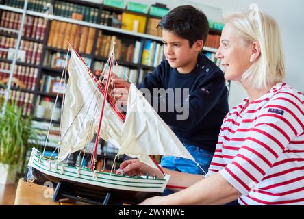 Grandmother and grandson, Building model sailboat, Whaleship, Getaria, Gipuzkoa, Basque Country, Spain, Europe. Stock Photo