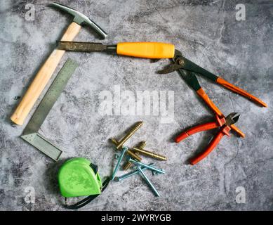Various working Tools. Different instruments. Construction, Building, repair concept. Screws, bolts, brush, hammer, tape measure, cutters Stock Photo