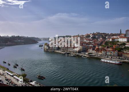 Douro river and local houses with orange roofs in Porto city aerial panoramic view. Porto is the second largest city in Portugal. Stock Photo