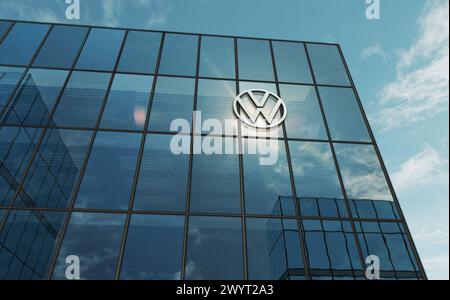 Wolfsburg, Germany, April 2, 2024: Volkswagen car producer headquarters glass building concept. Automobile manufacturer company symbol logo on front f Stock Photo