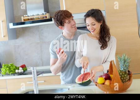 Young couple in kitchen. Stock Photo
