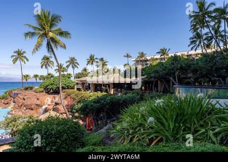 Lahaina, Hawaii, USA - August 8, 2021 - A view of the luxurious relaxation pool and Pacific Ocean at the Hyatt Regency Maui Resort and Spa in Lahaina, Stock Photo