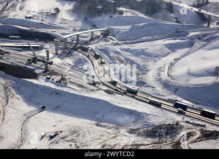 Fly-over under construction, A8 freeway with snow, Autopista del Cantábrico, Pasaia. Guipuzcoa, Basque Country, Spain. Stock Photo