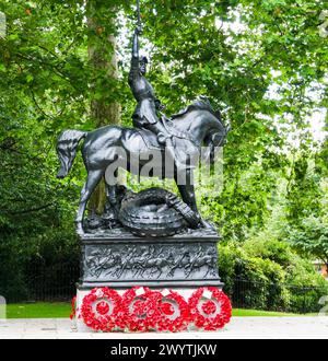 London, United Kingdom - July 17, 2009 : Cavalry Memorial adorned with poppy wreaths. A monument erected to the 'Cavalry of the Empire', in WW1, WW2. Stock Photo