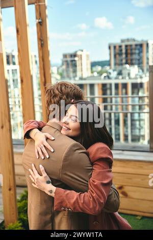 A heartfelt scene of a couple sharing an affectionate hug, their bodies intertwined in a tender and loving embrace Stock Photo