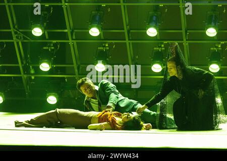 final scene - l-r: Piotr Beczala (Don Jose), Aigul Akhmetshina (Carmen), Ruth Alfie Adams (Mother of Don Jose) in CARMEN at the Royal Opera House, Covent Garden, London WC2  05/04/2024 music: Georges Bizet  libretto: Henri Meilhac & Ludovic Halevy  dramaturg: Elisa Zaninotto  conductor: Antonello Manacorda  set design: Paulo Fantin  costumes: Carla Teti  lighting: Alessandro Carletti  director: Damiano Michieletto Stock Photo
