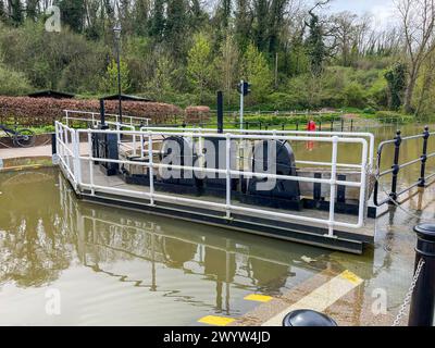 High water during the spring tide and eclipse, the river Medway bursts its banks at Allington Lock near Maidstone in Kent. Stock Photo