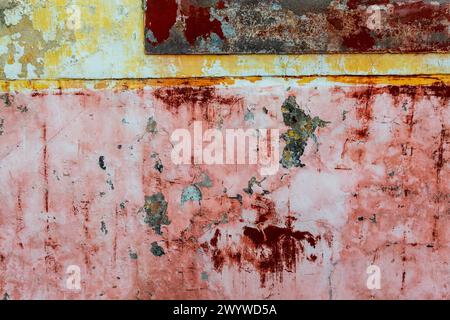 Old wall, peeling ocher and uellow paint colorful texture Stock Photo