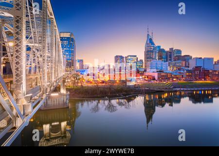 Nashville, Tennessee, USA. Cityscape image of Nashville, Tennessee, USA downtown skyline with reflection of the city the Cumberland River at spring su Stock Photo