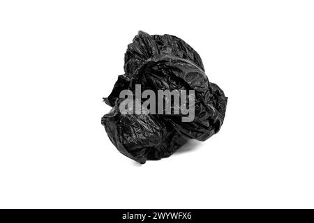 Crumpled black plastic garbage bag isolated on white background. Stock Photo