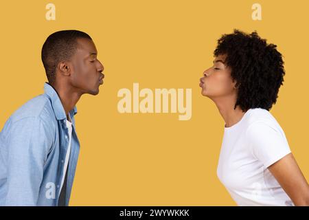 Two people facing each other in profile view Stock Photo