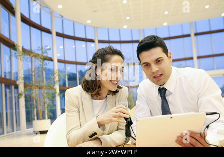 Executives with digital tablet, video conference. Stock Photo