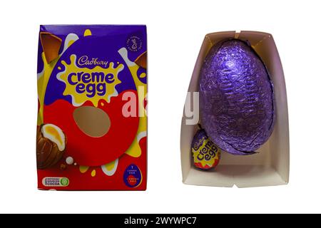 Cadbury Creme Egg Easter Egg box with Easter egg and creme egg removed from packaging isolated on white background Stock Photo