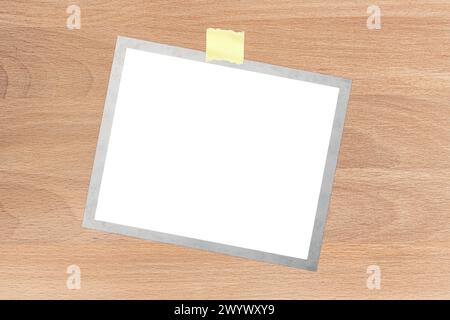 the polaroid card on the wood table Stock Photo