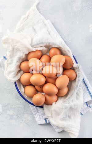 Fresh organic eggs on kitchen table Stock Photo