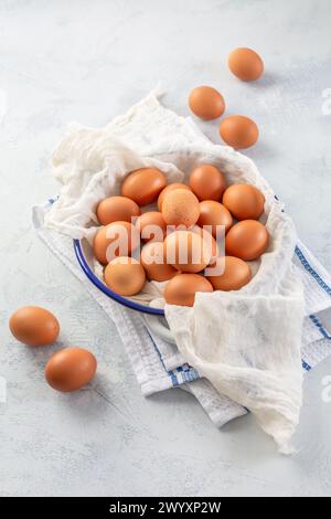 Fresh organic eggs on kitchen table Stock Photo