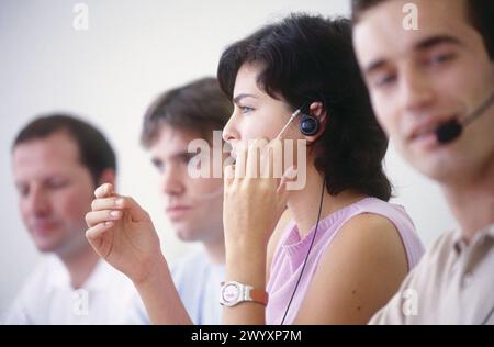Young people with headsets. Stock Photo