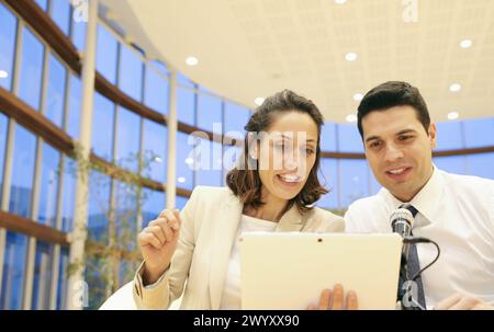 Executives with digital tablet, video conference. Stock Photo