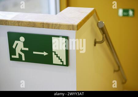 Emergency exit sign, stairs. Stock Photo