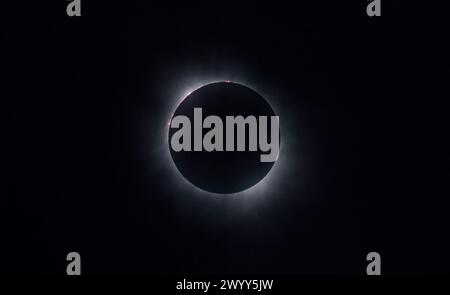 Kerrville, United States Of America. 08th Apr, 2024. Kerrville, United States of America. 08 April, 2024. The Moon passes in front of the Sun during a total solar eclipse, April 8, 2024, in Kerrville, Texas. A total solar eclipse swept across a narrow portion of the North American continent from Mexico to the Atlantic coast of Newfoundland, Canada. Credit: Aubrey Gemignani/NASA/Alamy Live News Stock Photo