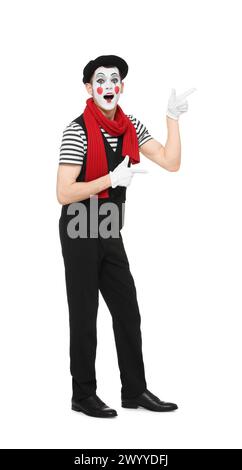 Funny mime artist in beret pointing at something on white background Stock Photo