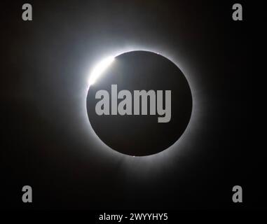 Commerce, United States. 08th Apr, 2024. A total solar eclipse begins in Commerce, Missouri on Monday, April 8, 2024. Dozens of viewers from all over the country made it to this village of 67 on the Mississippi to watch. Photo by Terry Schmitt/UPI Credit: UPI/Alamy Live News Stock Photo