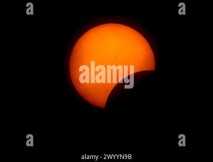 Pittsburgh, United States. 08th Apr, 2024. The moon starts to cover the sun as the Total Solar Eclipse pass over the James N. Thompson Land Light House on Monday April 8, 2024 in Erie Pennsylvania. Photo by Archie Carpenter/UPI Credit: UPI/Alamy Live News Stock Photo