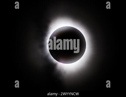 Pittsburgh, United States. 08th Apr, 2024. Light clouds pass in front of the Total Solar Eclipse during totality at the James N. Thompson Land Light House on Monday April 8, 2024 in Erie Pennsylvania. Photo by Archie Carpenter/UPI Credit: UPI/Alamy Live News Stock Photo