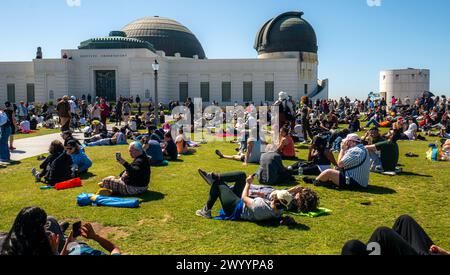 A crowd of people watching the 2024 solar eclipse in front of Griffith Observatory in Los Angeles, California, United States, on April 8, 2024. Stock Photo