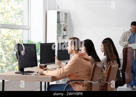 Team of young programmers working in office Stock Photo